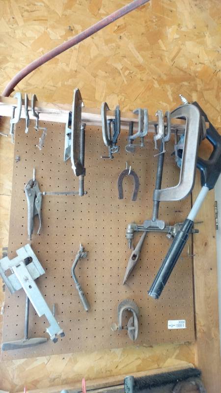 lot 3000 image: Contents of pegboard. C clamps and other tools.