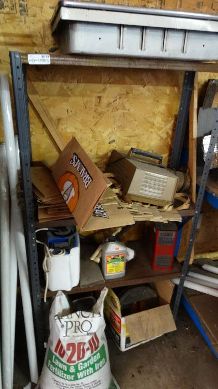 lot 3012 image: Shelf and contents. Medicine cabinet, projector, fertilizer, etc.