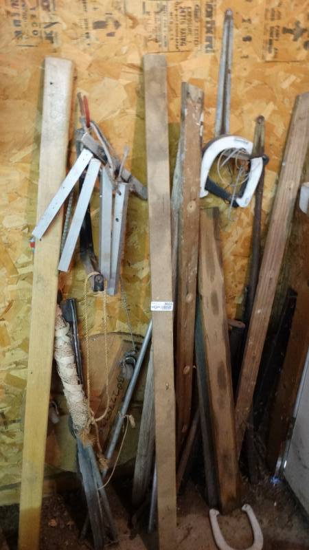 lot 3023 image: Horse shoes, roller cart, wooden handles, and etc.