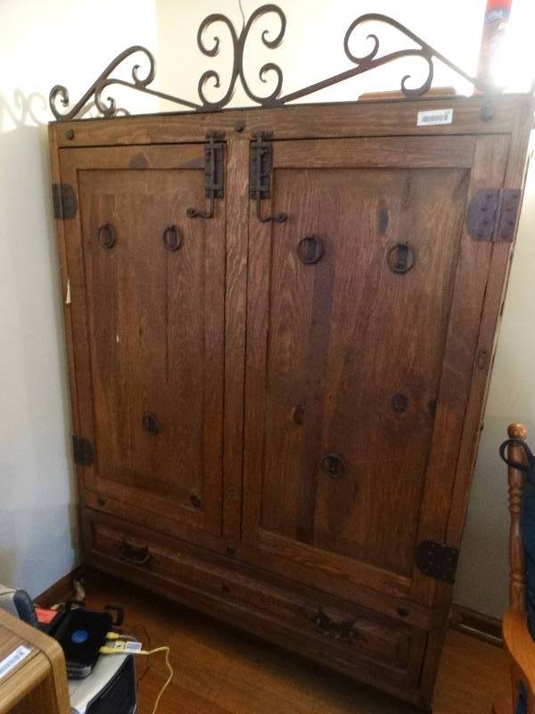lot 556 image: Wood w metal trim armoire w contents