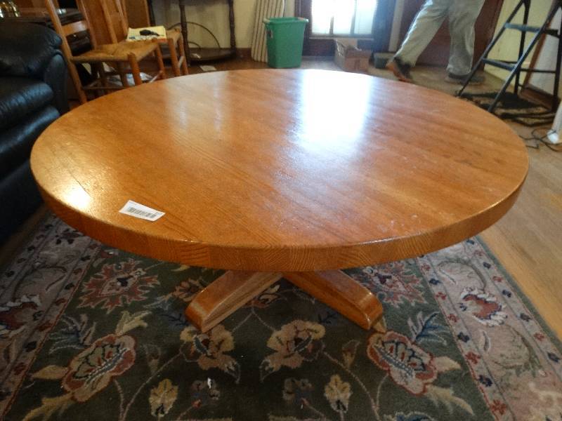 lot 557 image: Round wood coffee table