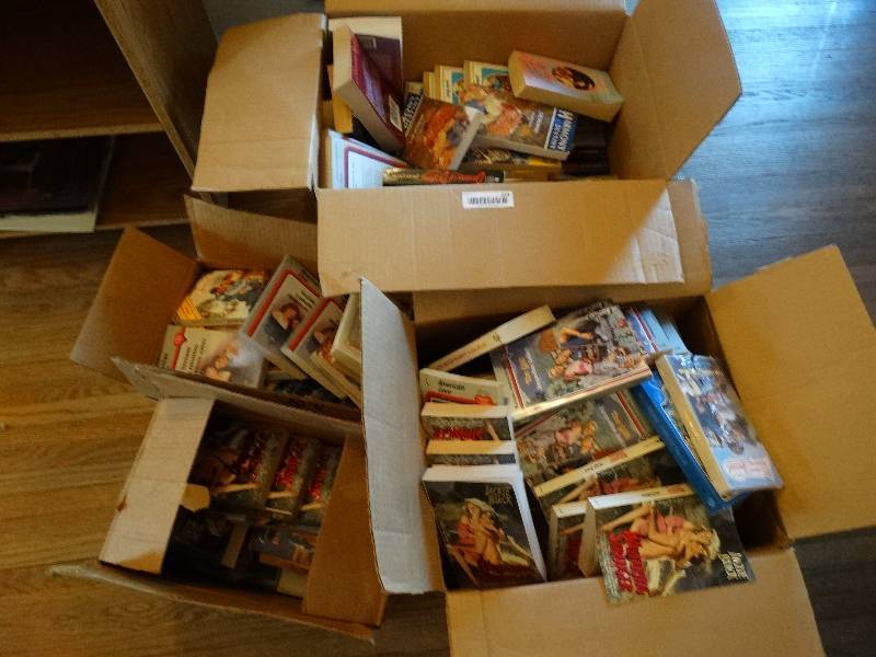 lot 559 image: 4 boxes of paper back novels