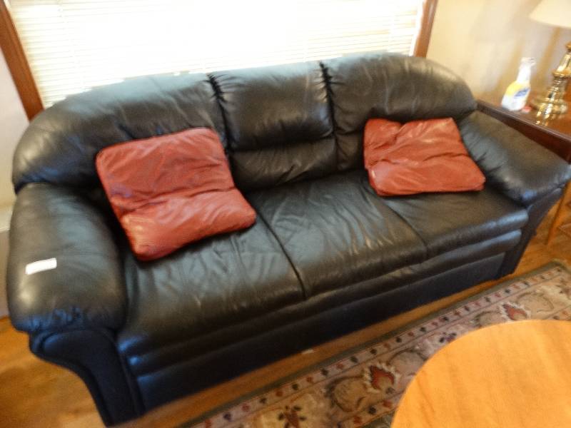 lot 561 image: Black sofa w 2 pillows