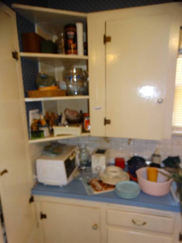 lot 585 image: Lg lot of various kitchenware- Plates bowls toaster toaster oven misc.
