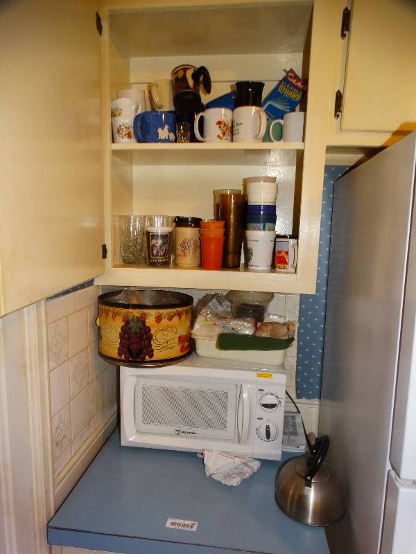 lot 588 image: Lg lot of various kitchenware- Pots pans cups microwave misc.