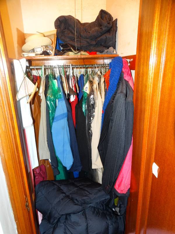 lot 603 image: Contents of closet- Clothes & misc.