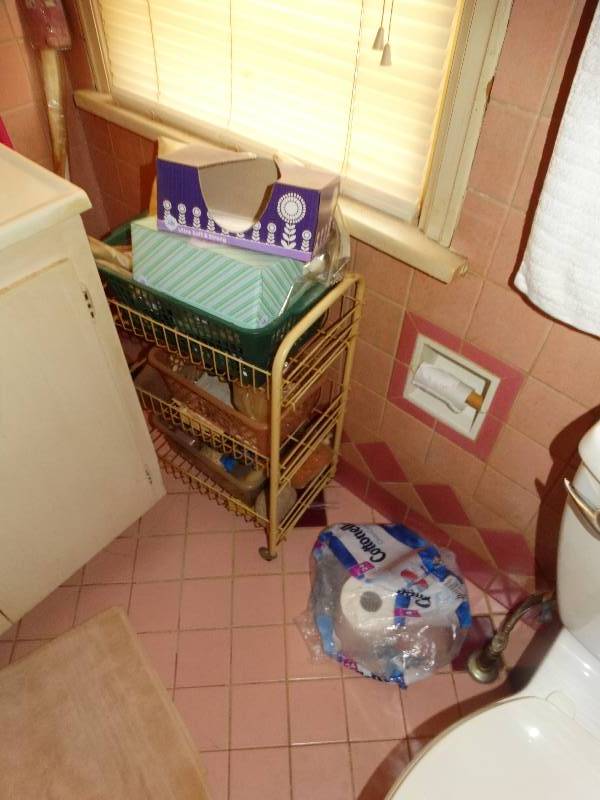 lot 630 image: Contents of bathroom- Cleaning supplies rack towels scale misc.