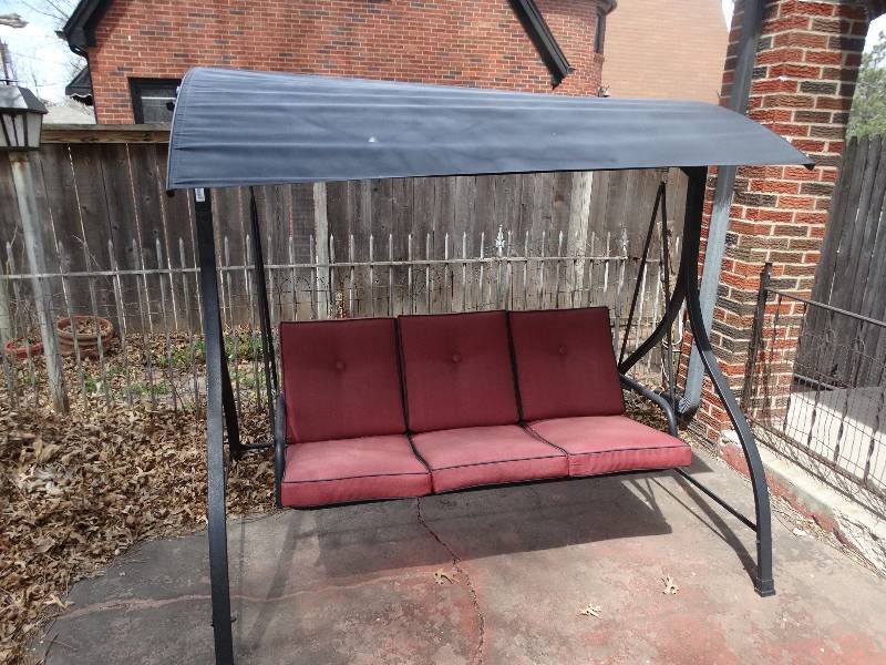 lot 687 image: Lg metal patio swing w cushions & canopy