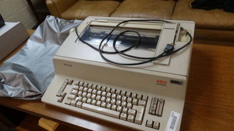 lot 1022 image: Olympia AEG typewriter w dust cover