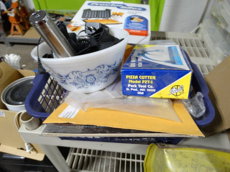 lot 4056 image: Lot of electric razor wattachments, pizza cutter, old cell phone, ect.