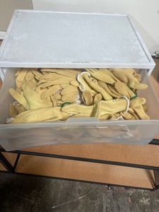 lot 7862022 image: plastic tote of Kevlar gloves size large