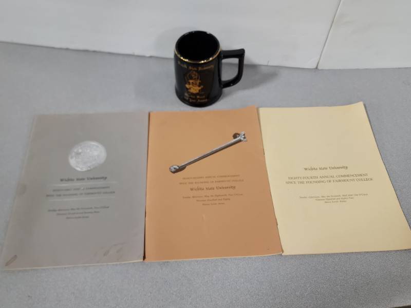 lot 12658 image: Vintage WSU Memorabilia Collection - 1979-1982 Commencement Programs & Shocker Band Mug