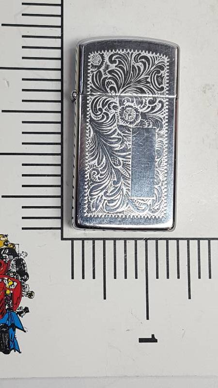 lot 6487 image: Its been used but not very much Zippo Engraved but not monogrammed yet cigarette lighter