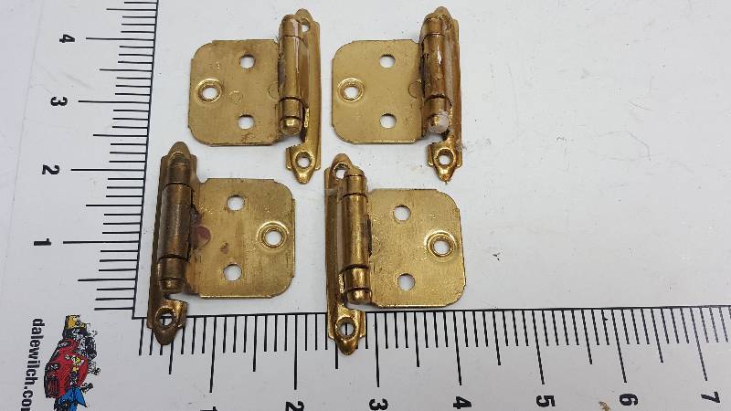 lot 6484-4 image: Nice set of 4 brass plated cabinet hinges.  These have been used but are in excellent shape