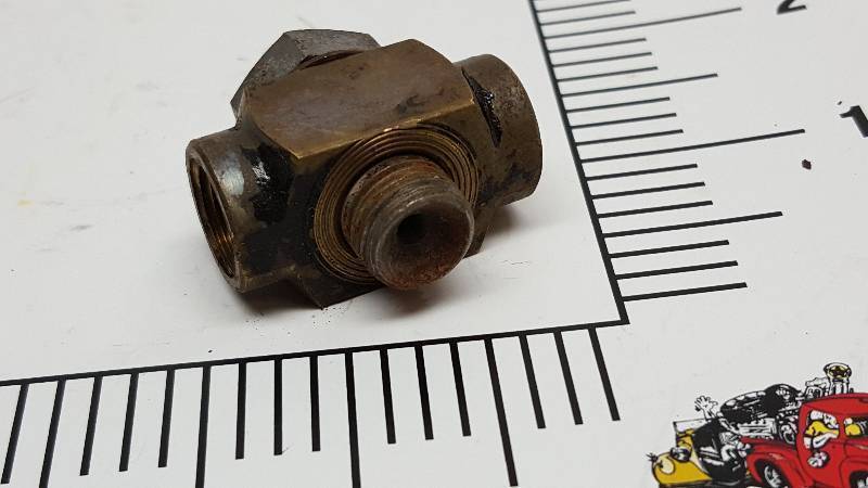 lot 5728 image: Made for the top of the automotive brake block housing and with 516 inverted flare female line fittings on the side
