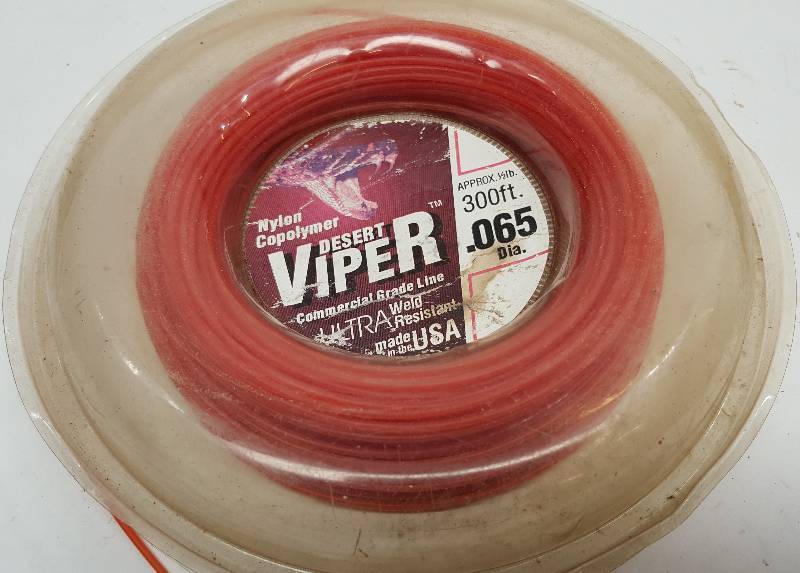 lot 6218 image: Looks like this roll of weed eater string is about half gone.  Put it on the shelf for a later date