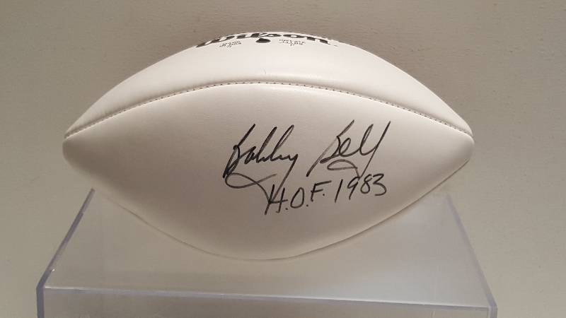 lot 1102 image: Bobby Bell Autographed Full Size Wilson Official NFL 75th Anniversary Football Inscription & COA