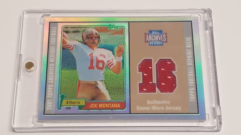 lot 1182 image: 2001 Topps Archives Reserve Joe Montana Game Used Jersey Relic Refractor Rookie Reprint