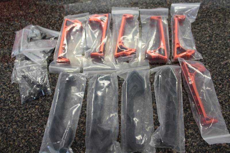 lot 2015 image: Red and Black Mlok angled foregripshandstops for AR 15s