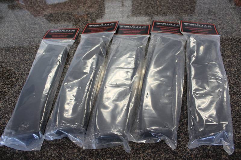 lot 2048 image: AR 15 50 round magazines and a .22lr magazine
