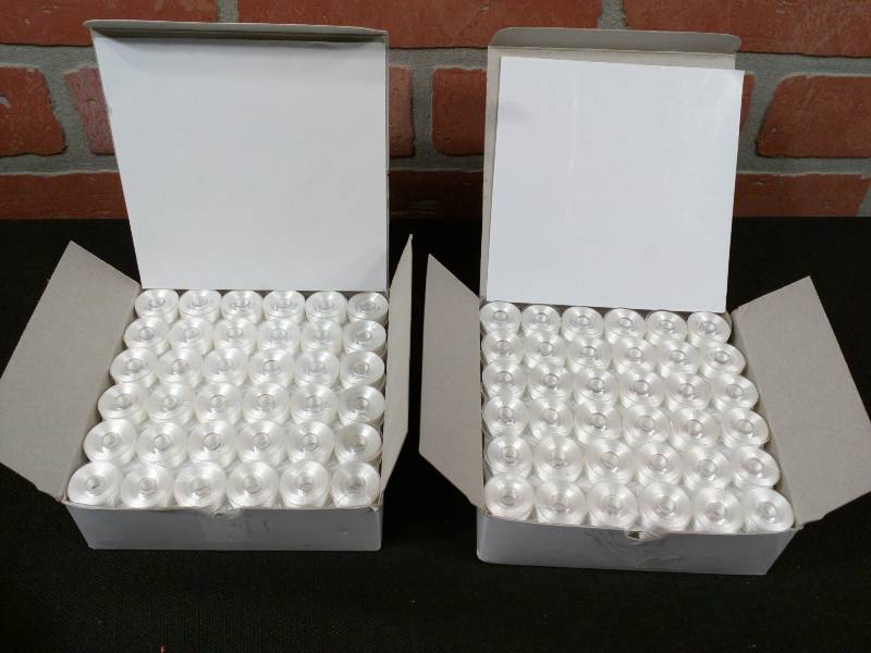 lot 170 image: All Stitch Plastic Sided White Embroidery Bobbins