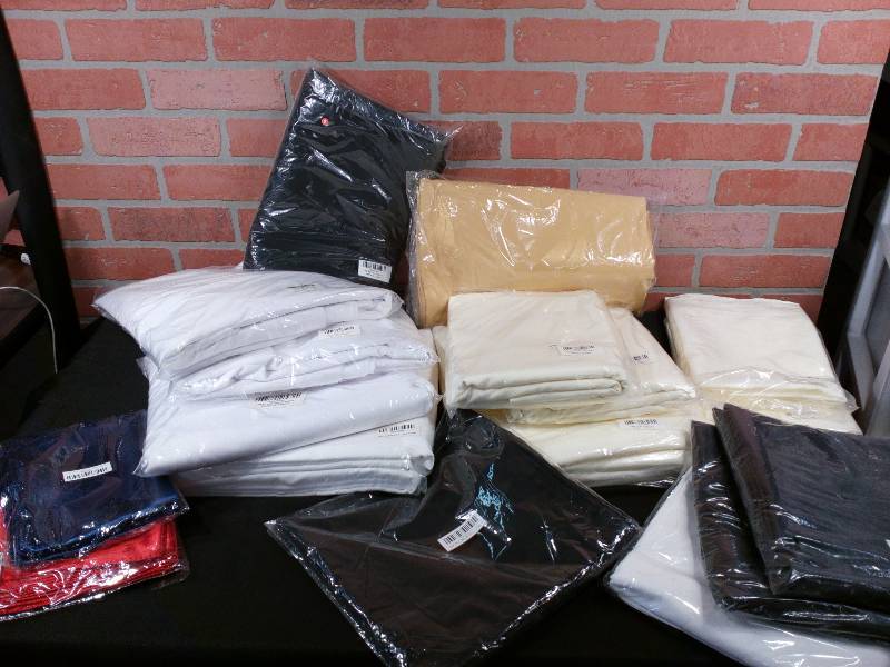 lot 240 image: Party Linen Assortment Tablecloths Napkins Chair Bows