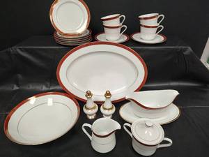 lot 157 image: Fine China Dinnerware Set with Red and Gold Trim Serving Set and Extras
