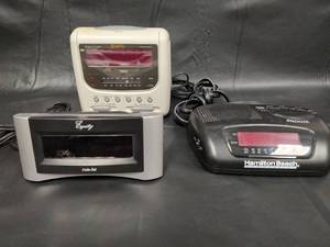 lot 174 image: Lot of 3 Digital Alarm Clock Radios - GPX, Equity, Hamilton Beach
