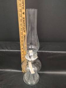 lot 193 image: Vintage Clear Glass Oil Lamp with Ornate Base and Chimney