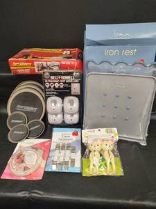 lot 260 image: Description NIB Bell and Howell Ultrasonic Pest Repellers, NIB Iron Rest, Furniture Sliders, and More