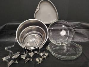 lot 266 image: Metal Mixing Bowls, Pyrex Pie Plates, Heart Pan & Star Cookie Cutters