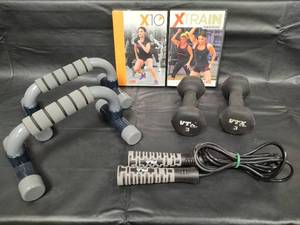lot 274 image: Cathe Friedrich X10 and XTrain Workout DVDs with Exercise Equipment