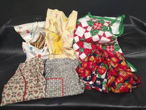 lot 408 image: Clothespin Bag, Four Childrens Aprons and One Adult Apron