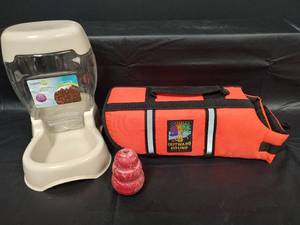 lot 498 image: Pet Supply Lot - Pet Feeder, Outward Hound Life Jacket, Kong Toy