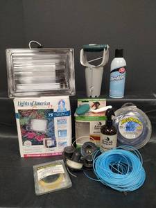 lot 502 image: Assorted Lot - NIB Outdoor Fluorescent Flood Light, Weed Trimmer String, Bulb Planter and More