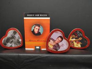 lot 515 image: Elvis Presley Collection - Elvis Presley Book Written by Bobbie Ann Mason and Heart Shaped Tins