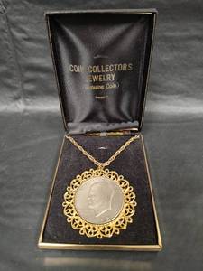 lot 527 image: 1972 Eisenhower Dollar Coin on 24 inch Necklace with Gold-Tone Filigree Frame