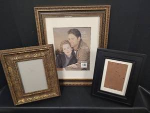 lot 572 image: Picture Frame Collection - 11x14 Gold Ornate Frame with Matting, 5x7 Goldtone Print Frame and 5x7 Black with Mat Frame
