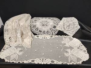 lot 582 image: White Lace Doily Collection - 36 Oblong Angel Pattern, 42 Round Goose with Bow Pattern and More