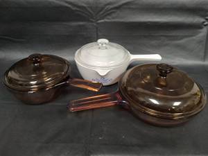 lot 583 image: Corning Ware and Pyrex Saucepan Set - White with Blue Cornflower Pattern and Brown Glass Cookware