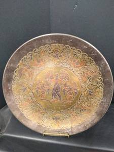 lot 596 image: Reed & Barton Handcrafted Damascene Limited Edition Christmas Plate 1972, #3487 of 7500, Features ornate gold and copper-toned etched design with angelic figures in center medallion surrounded by intricate scrollwork border pattern, 11 inches