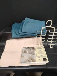 lot 605 image: 3 - 37 x 84 Eclipse Polyester Teal Drapes, NIP Cannon Percale Twin Flat Sheet and NIP Microfiber Rug and Accessory Organizer Hanger