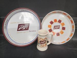 lot 56 image: Schlitz Beer Advertising Set - Ceramic Mug and Two Serving Trays