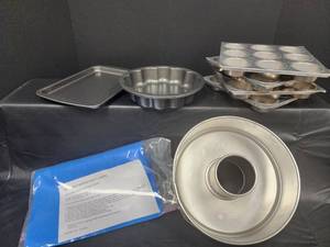 lot 57 image: Reusable Silicone Baking Sheet Liners and Molds Set