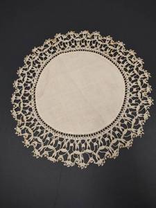 lot 665 image: Handmade Crocheted Lace Doily with Intricate Border and Solid Cotton Center, 14 inch