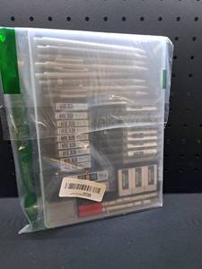 lot 12153 image: Lot of Erasers and Writing Supplies in Storage Case