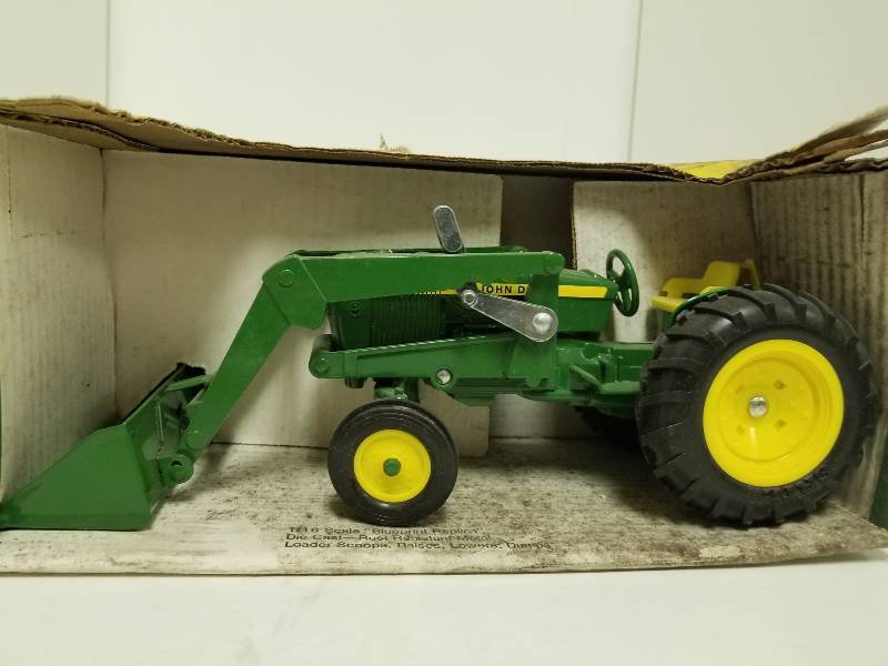 lot 1021 image: Ertl John Deere Utility Tractor wEnd Loader, 116 scale, #517, NIB but dusty