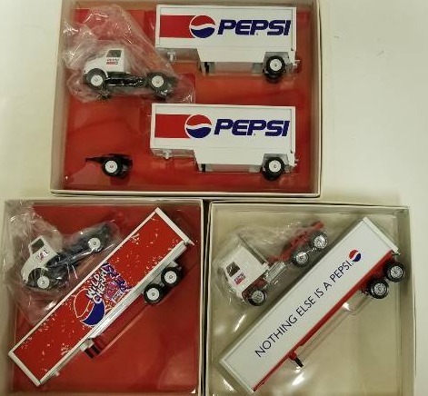lot 1042 image: 3 Winross Pepsi 164 scale trucks, 2 Semi with pepsi box truck and 1 Semi with 2 Pepsi Pups, NIB