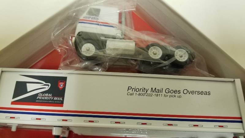 lot 1052 image: Winross Semi Truck Priority Mail Goes Overseas, 164 scale, NIB