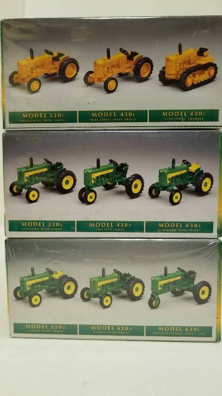lot 1073 image: Ertl, 1 lot of 3 boxes each with 3 John Deere Tractors, 164 scale, # 573557265736, See Pix, NIB